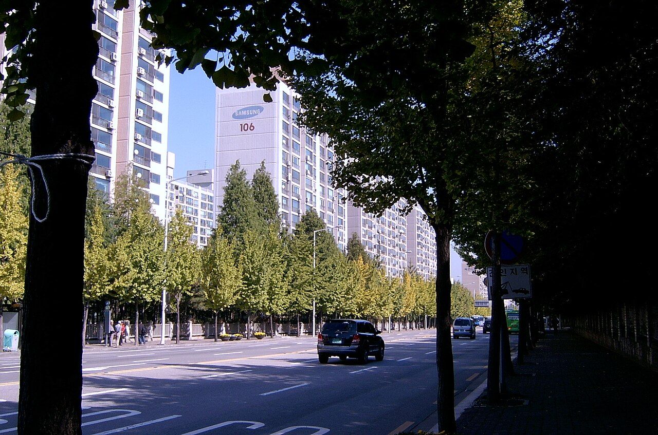 A quiet residential street in the Gangnam area of Seoul, near the Sinsa-dong office.